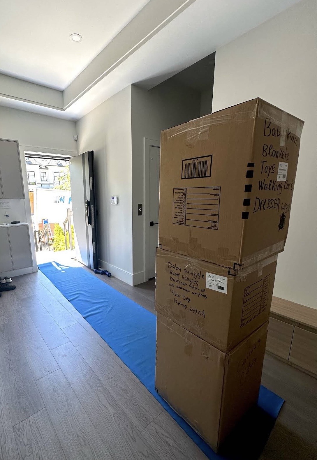 Keep Moving Markham movers loading boxes onto a moving truck