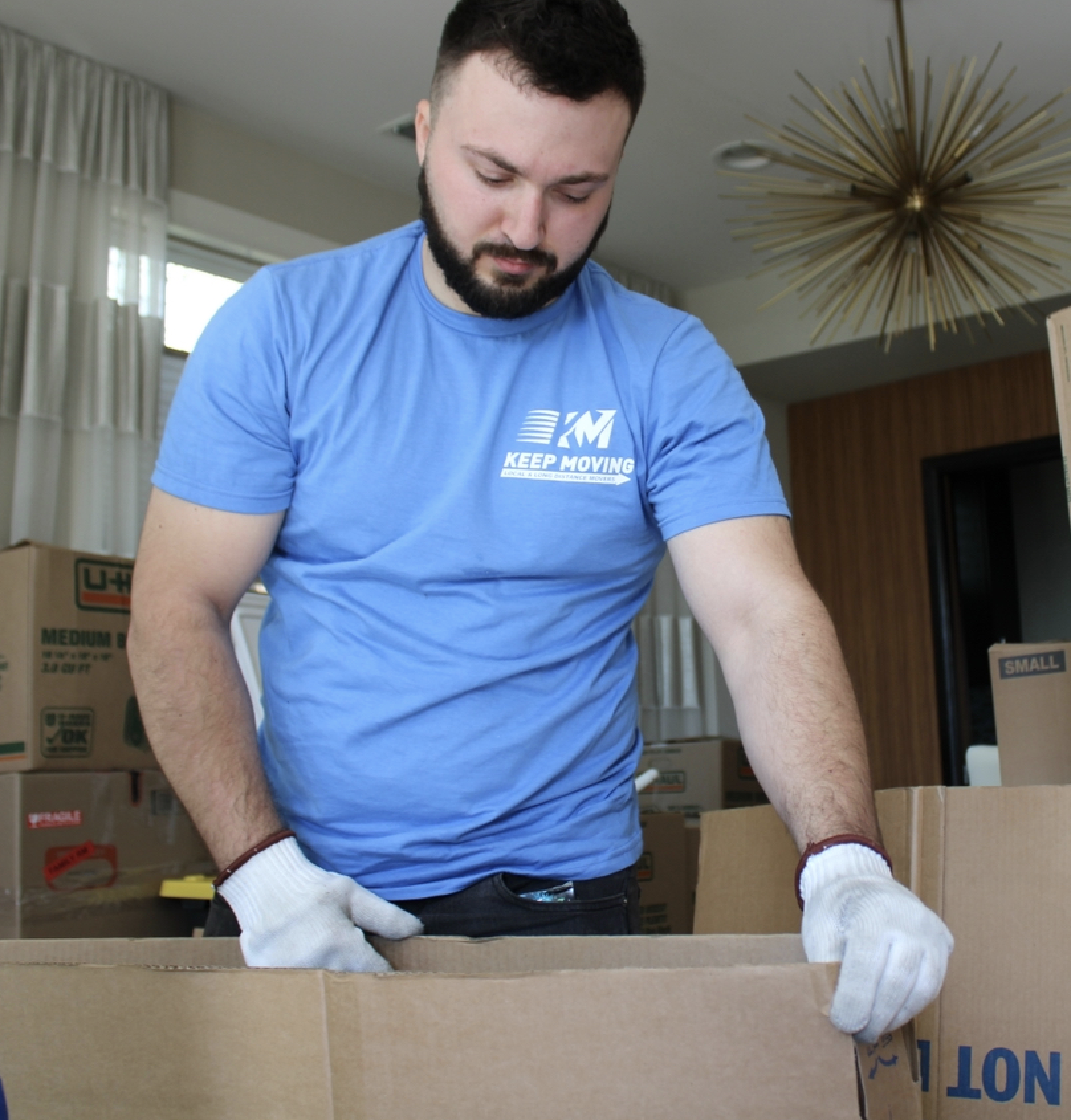 Keep Moving movers loading a long-distance moving truck for a Toronto to Quebec City move