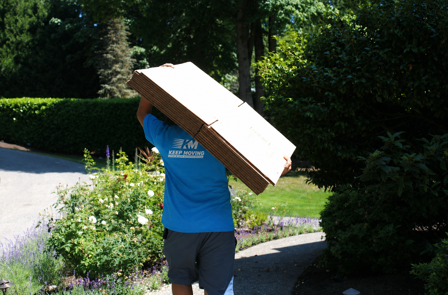 Movers carrying wrapped furniture from an Ontario home