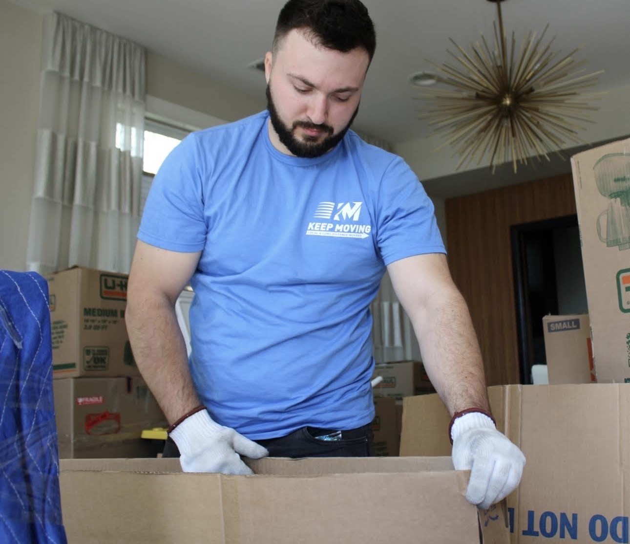 Toronto apartment movers loading boxes onto a moving truck